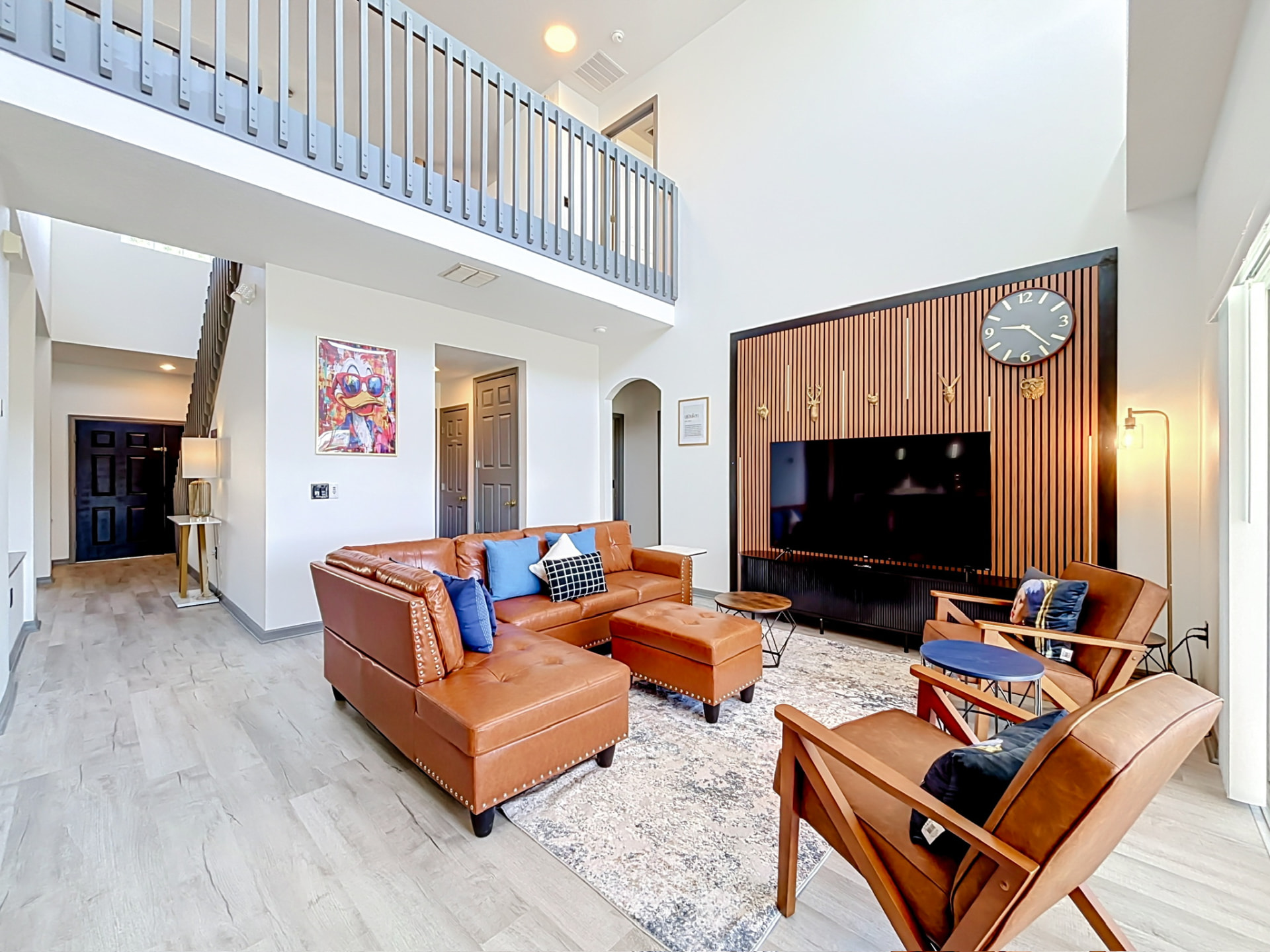 Spacious living room with warm leather seating