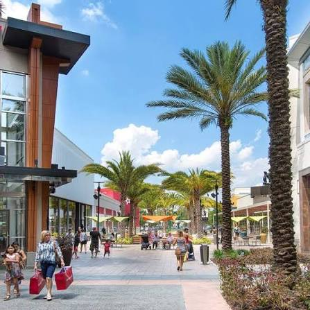 Shoppers walking through the outdoor promenade of The Florida Mall