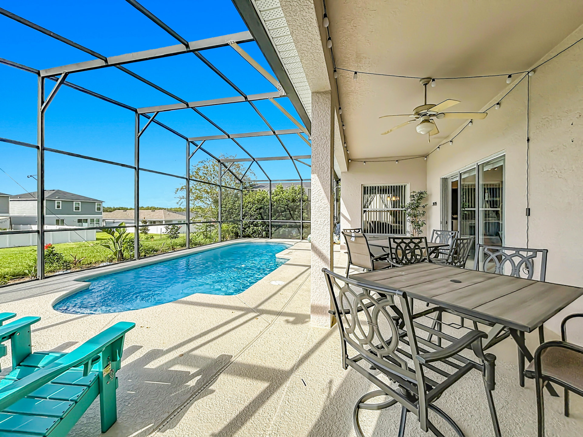 Screened private pool and covered patio dining area