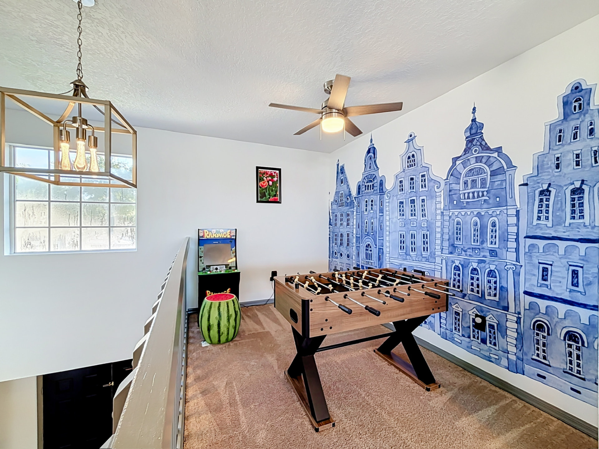 Upstairs game room with foosball and arcade game